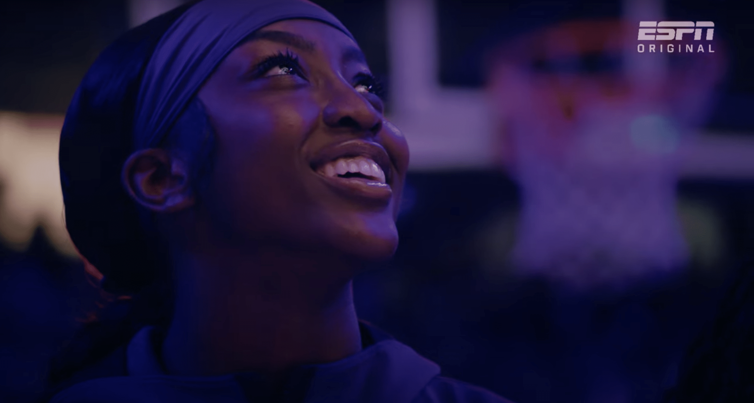Flau'jae Johnson bears a huge smile as she looks upwards.